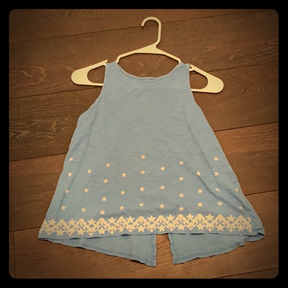 Blue tank top with white stars on bottom